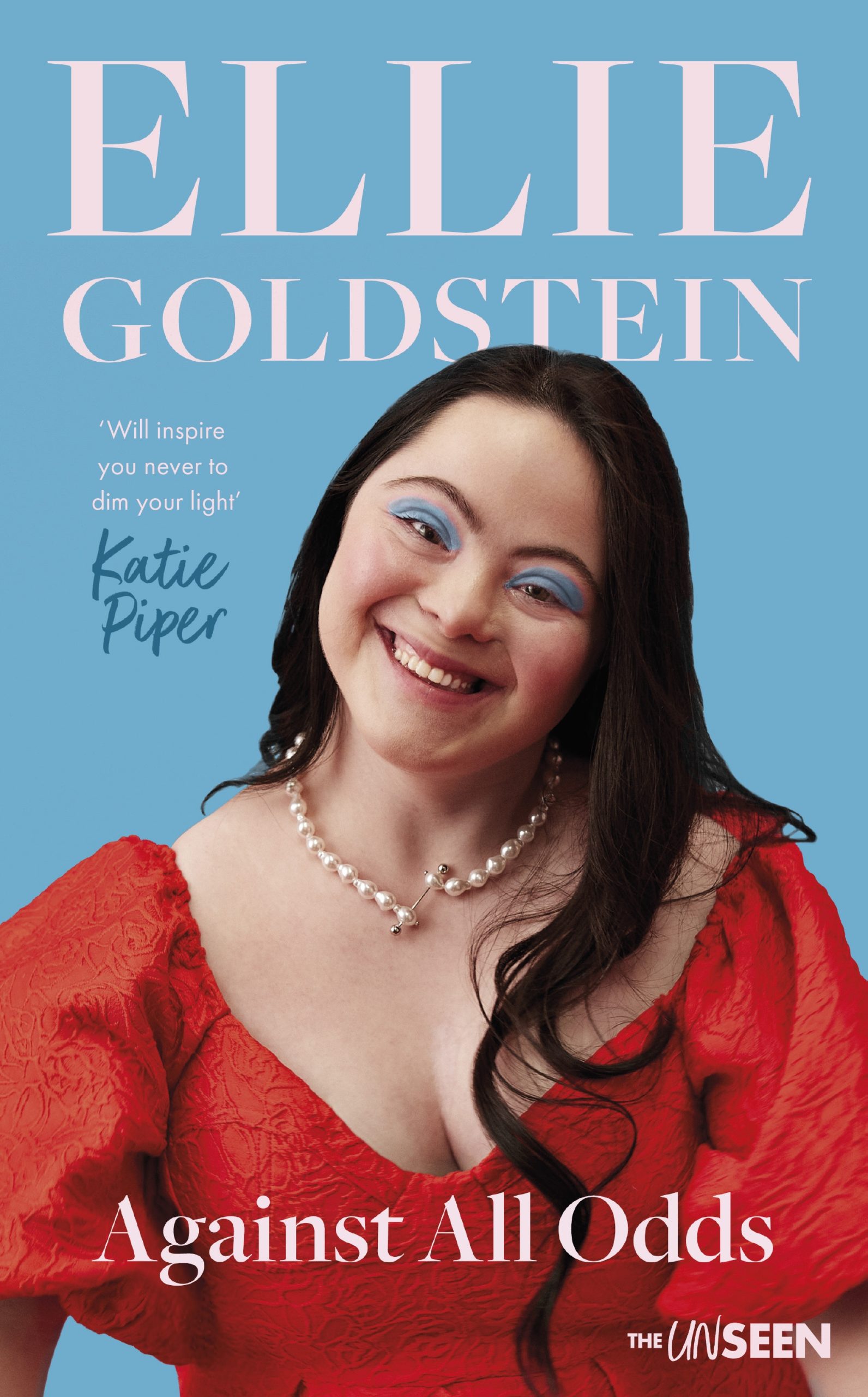 Book cover with pink, black and white text and a woman in red dress smiling