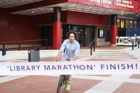 Waterstones Children's Laureate Joseph Coelho crosses The Library Marathon finish line (c) British Library