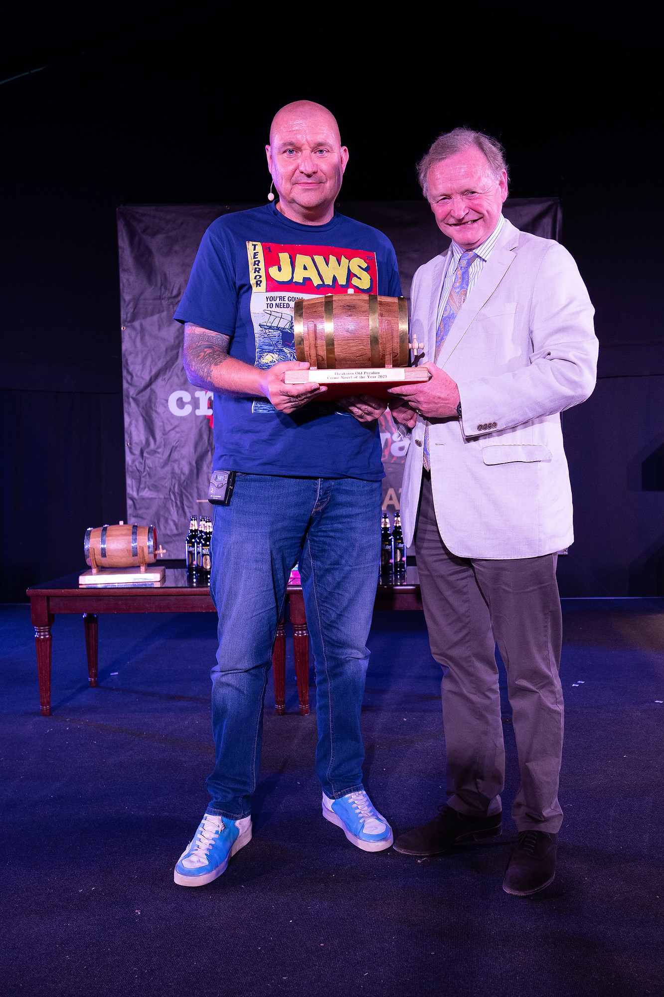 two men holding award