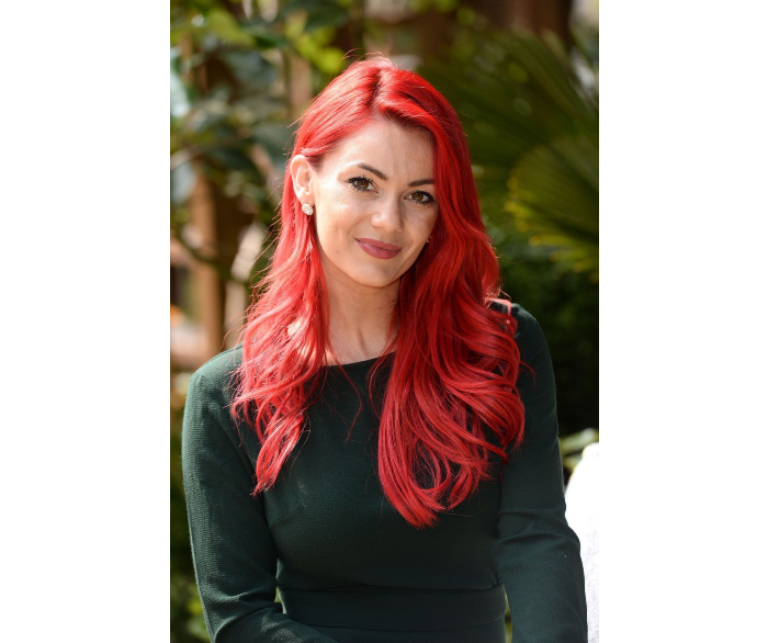 woman smiling in green top