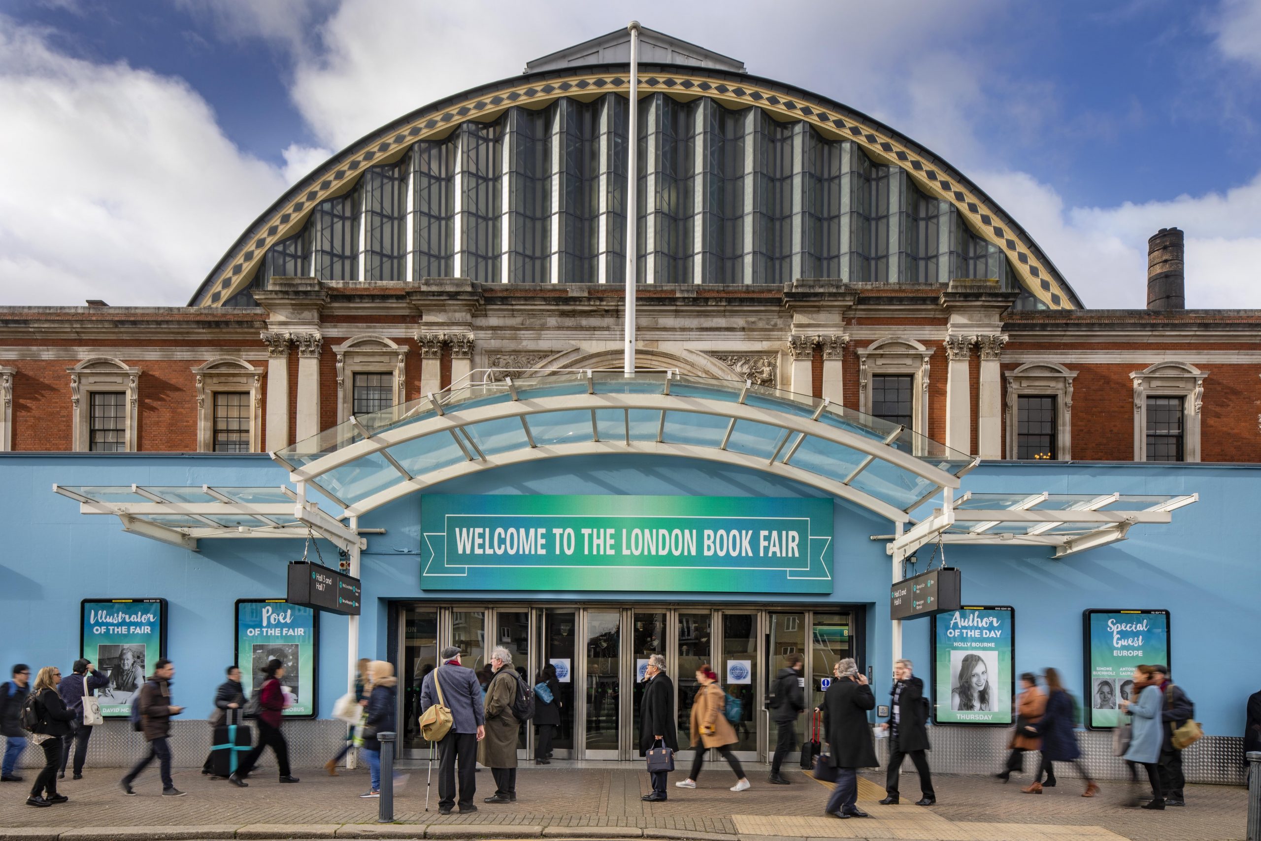 historic building with blue and green banner