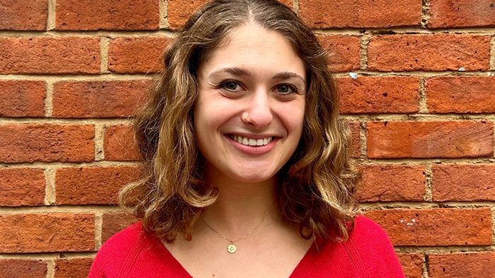 woman in red top smiling