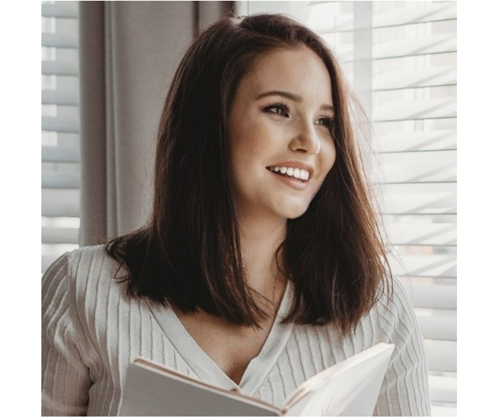 woman wearing cream blouse