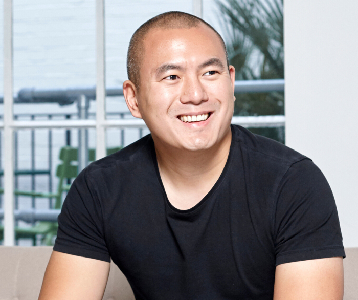 man in black t-shirt smiling