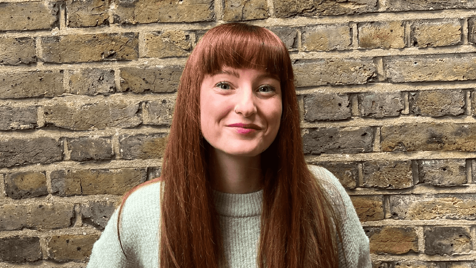 woman smiling wearing jumper