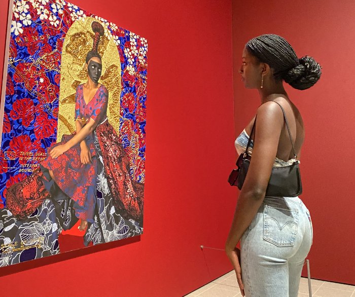 woman looking at artwork