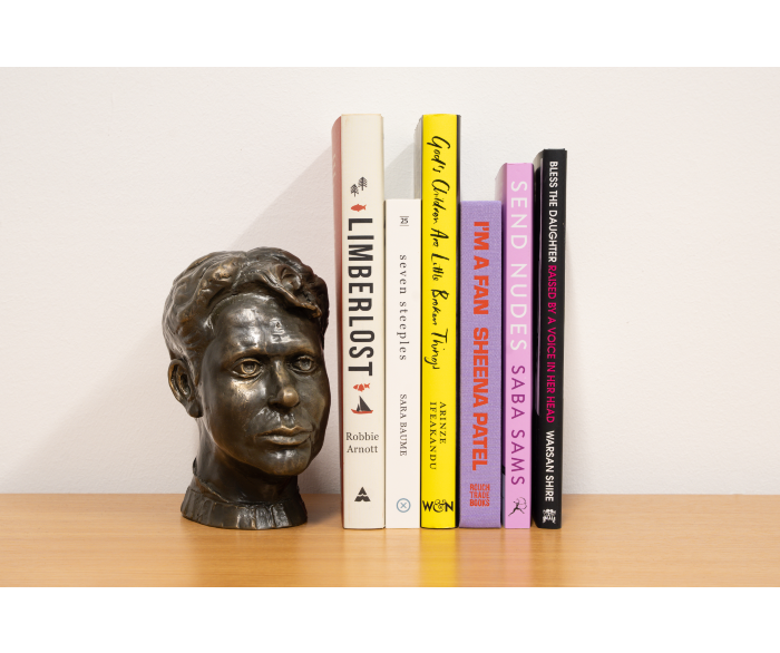 art sculpture next to books